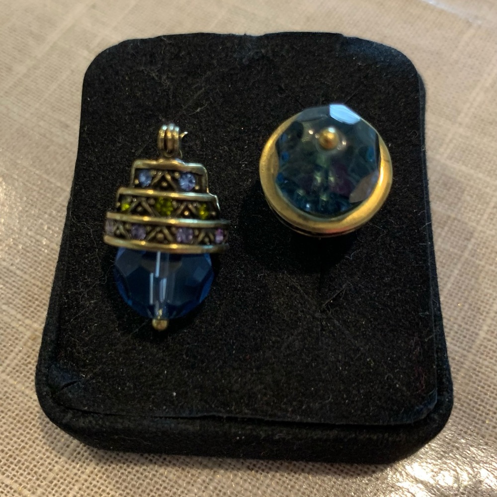 Earrings vintage style with blue stone in gold tone setting.